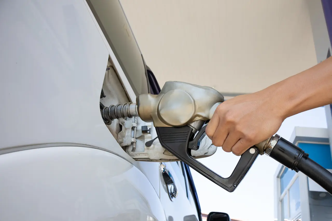 A Diesel Dispenser That is Filling Up With a Car